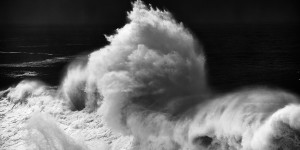 fine art black and white seascape of a huge wave from cyclone Ophelia hitting the Portuguese coast
