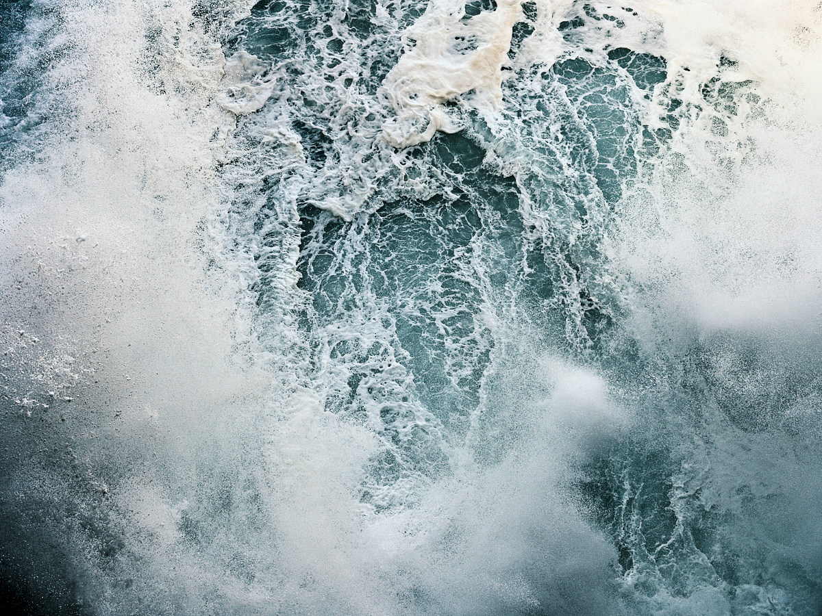 the angry sea that pounds the cliff